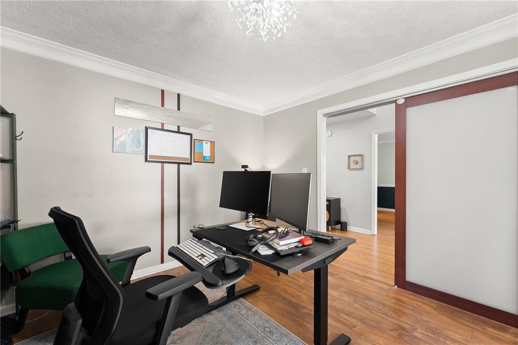 4055 Ivy Run Circle Duluth, GA 30096 - Photo 12 of 55 a view of a workspace with furniture and wooden floor