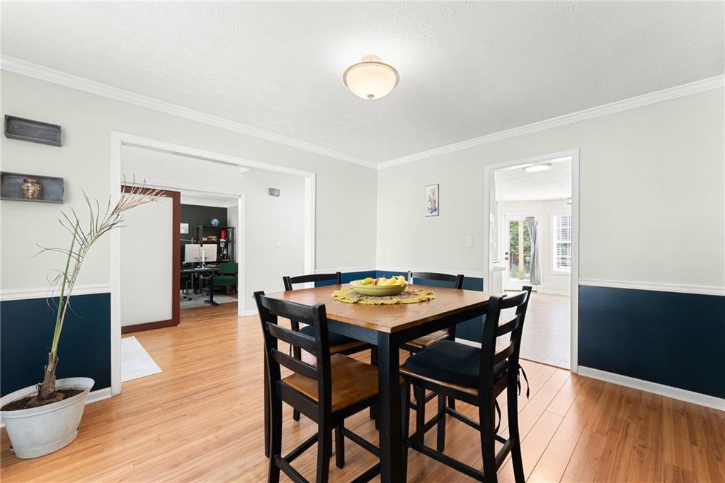 4055 Ivy Run Circle Duluth, GA 30096 - Photo 14 of 55 a dining room with furniture and wooden floor