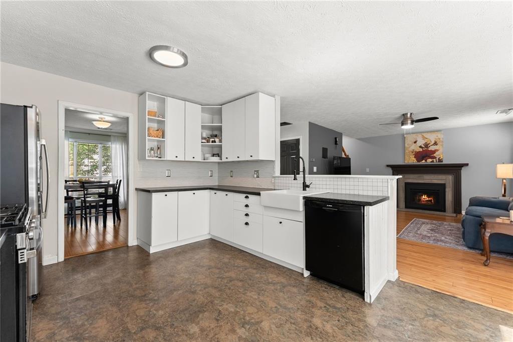 4055 Ivy Run Circle Duluth, GA 30096 - Photo 17 of 55 a kitchen with a sink stove and cabinets