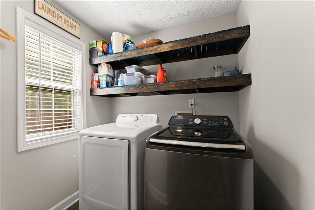 4055 Ivy Run Circle Duluth, GA 30096 - Photo 25 of 55 a kitchen with stainless steel appliances a stove and a window