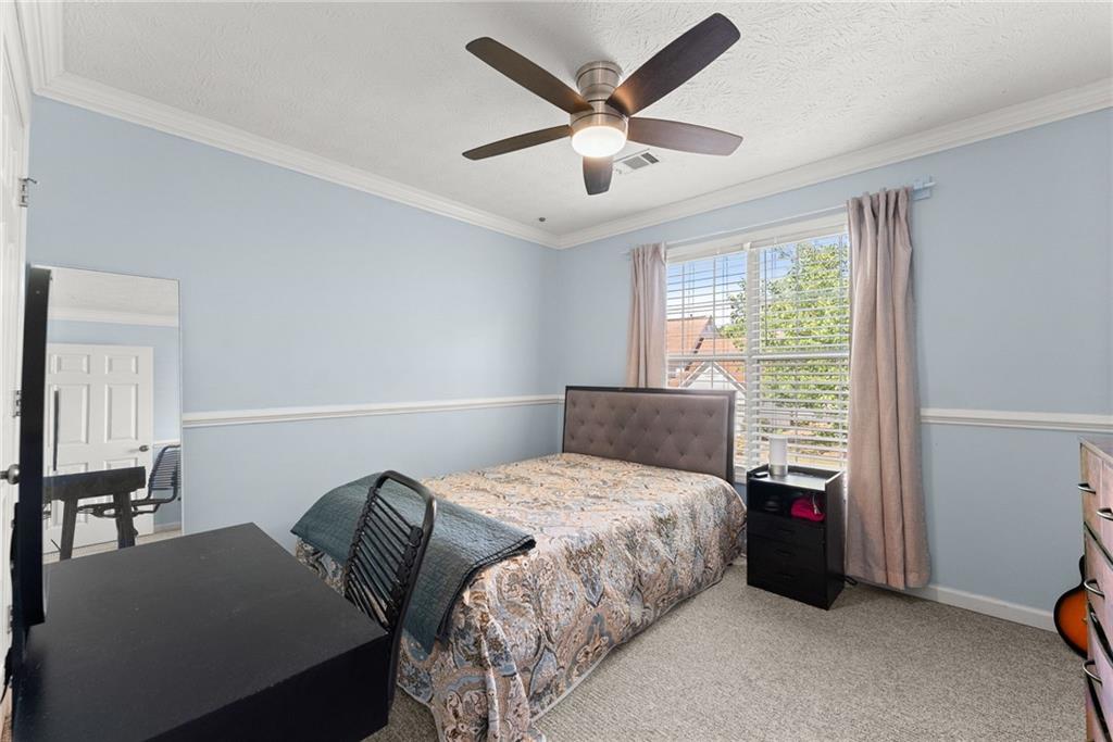 4055 Ivy Run Circle Duluth, GA 30096 - Photo 28 of 55 a bedroom with a bed and a large window