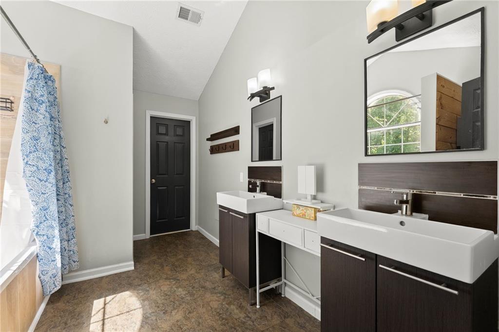 4055 Ivy Run Circle Duluth, GA 30096 - Photo 32 of 55 a bathroom with a sink and a mirror