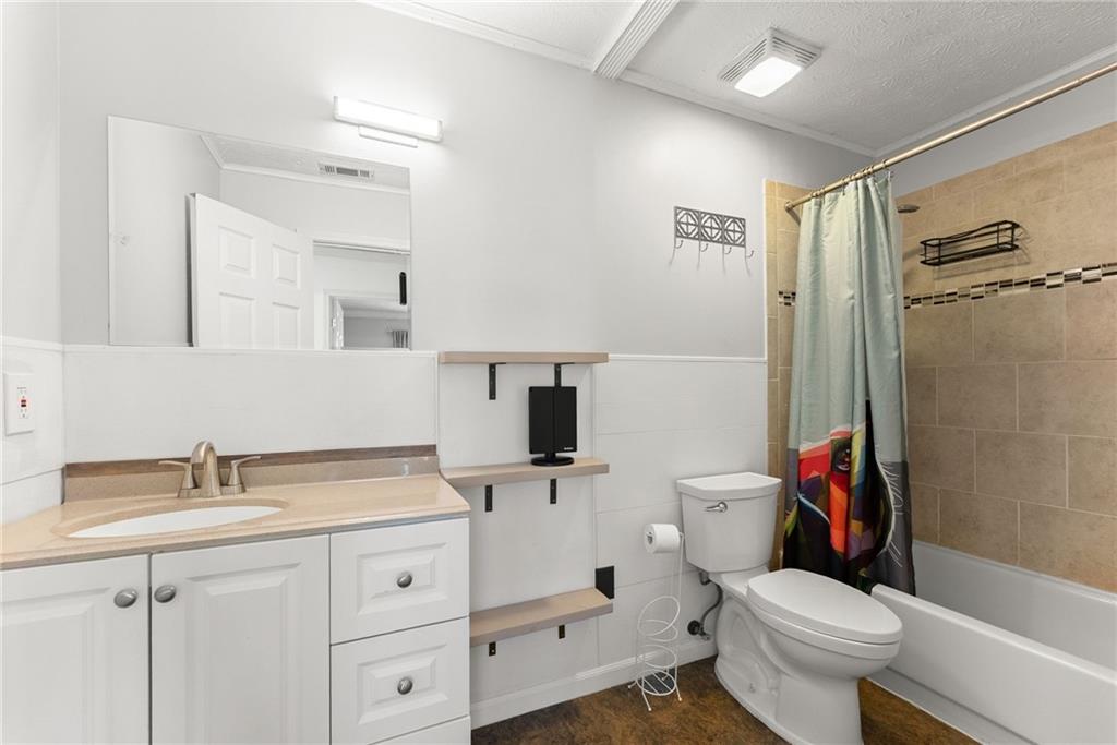4055 Ivy Run Circle Duluth, GA 30096 - Photo 34 of 55 a bathroom with a sink a toilet and shower