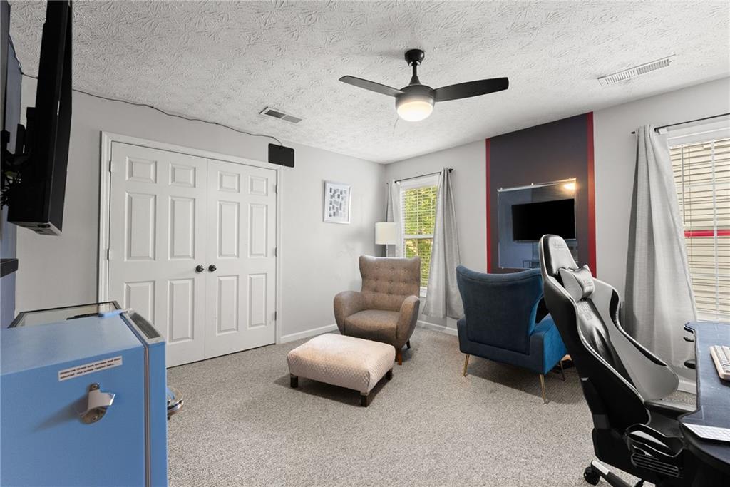 4055 Ivy Run Circle Duluth, GA 30096 - Photo 35 of 55 a living room with furniture and a window