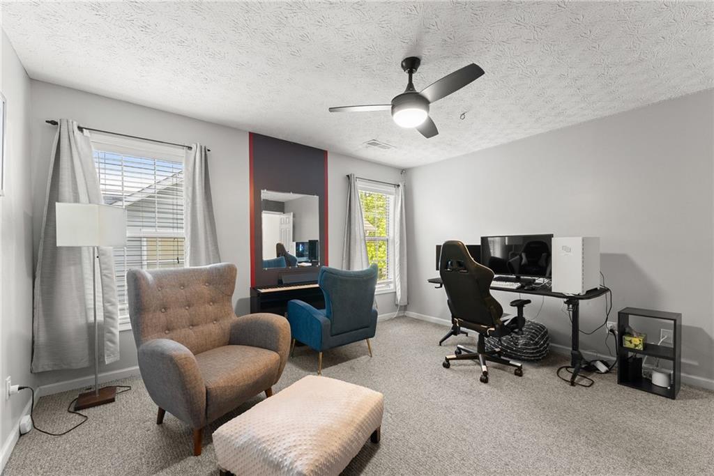 4055 Ivy Run Circle Duluth, GA 30096 - Photo 36 of 55 a living room with furniture and a window