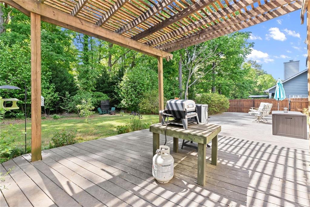 4055 Ivy Run Circle Duluth, GA 30096 - Photo 38 of 55 a view of a patio with a table chairs and backyard