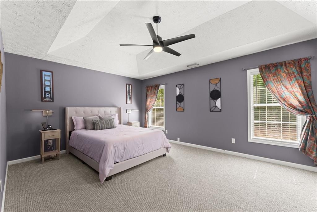 4055 Ivy Run Circle Duluth, GA 30096 - Photo 5 of 55 a bedroom with a bed and a large window