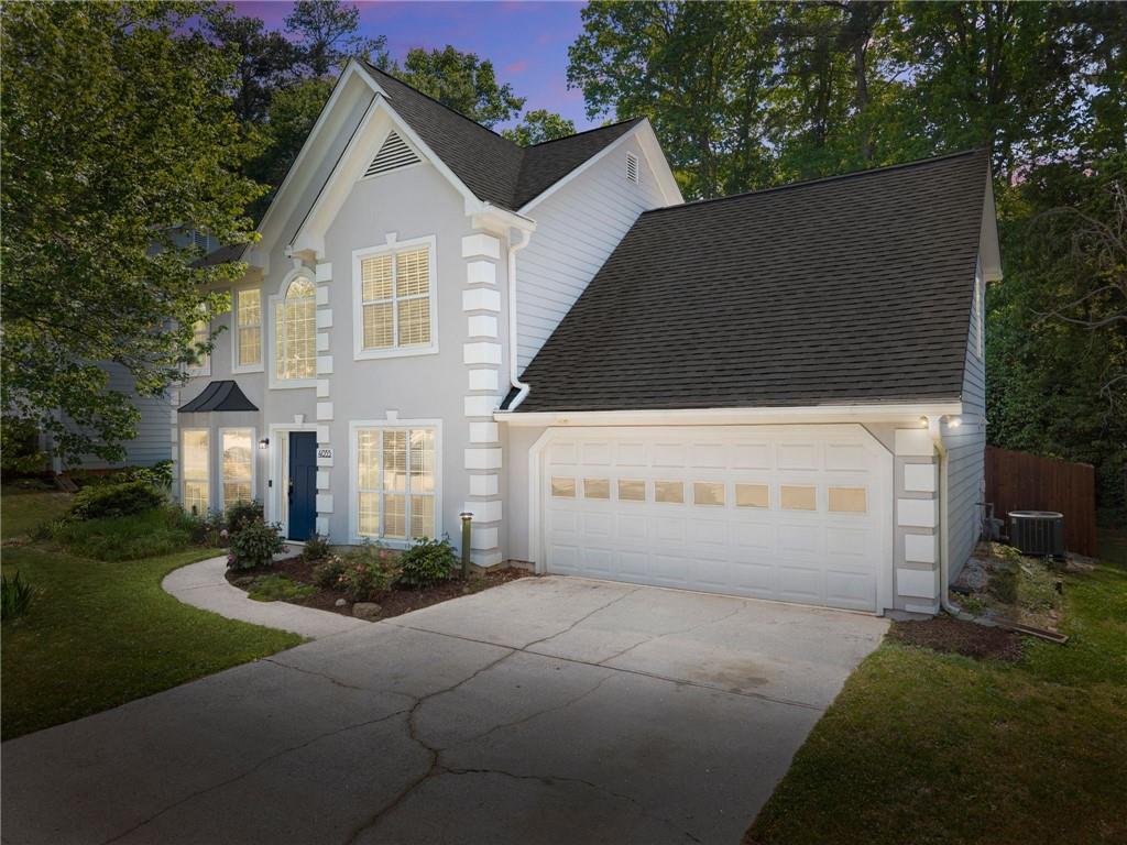 4055 Ivy Run Circle Duluth, GA 30096 - Photo 54 of 55 a front view of a house with a yard and garage
