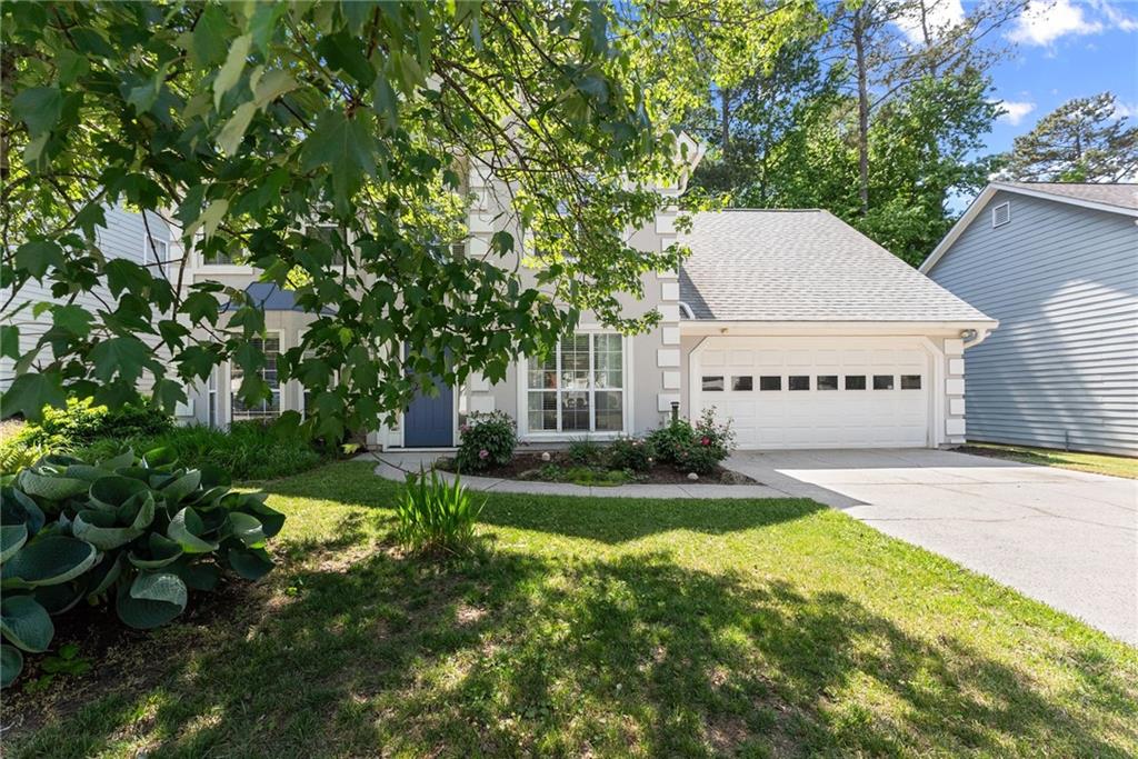 4055 Ivy Run Circle Duluth, GA 30096 - Photo 55 of 55 a view of a house with a yard and sitting area
