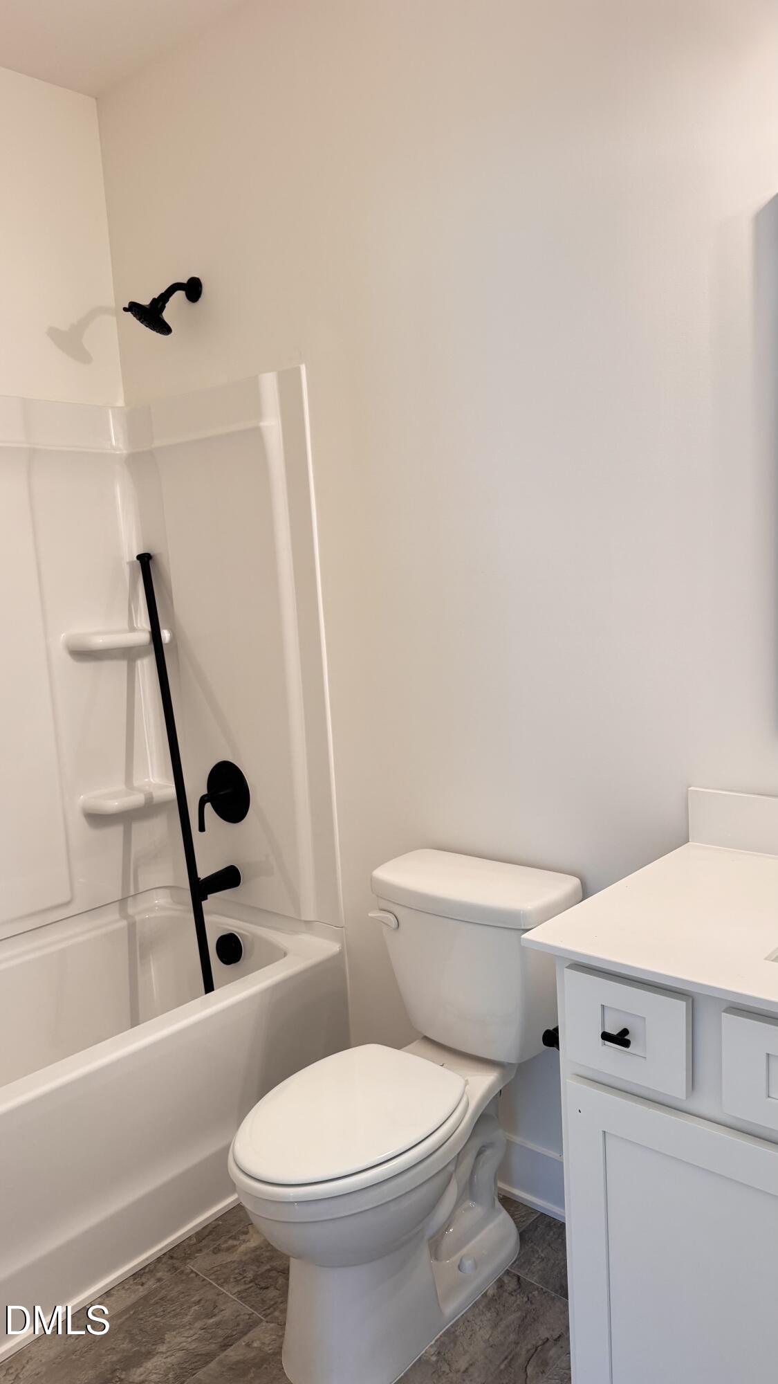 20 Streamline Court Lillington, NC 27546 - Photo 6 of 46 a white toilet sitting next to a bath tub