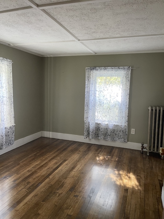 29 Jasper Street Saugus, MA 01906 - Photo 18 of 28 a view of empty room with wooden floor and fan