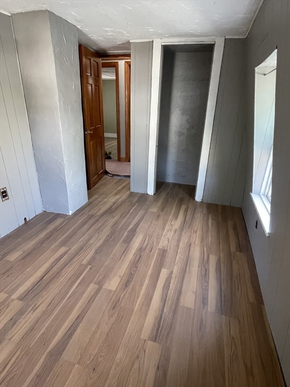 29 Jasper Street Saugus, MA 01906 - Photo 20 of 28 a view of empty room with wooden floor and window