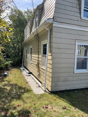 a view of a street with a yard