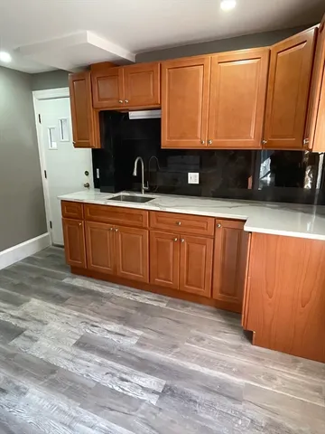 a kitchen with a stove and a sink