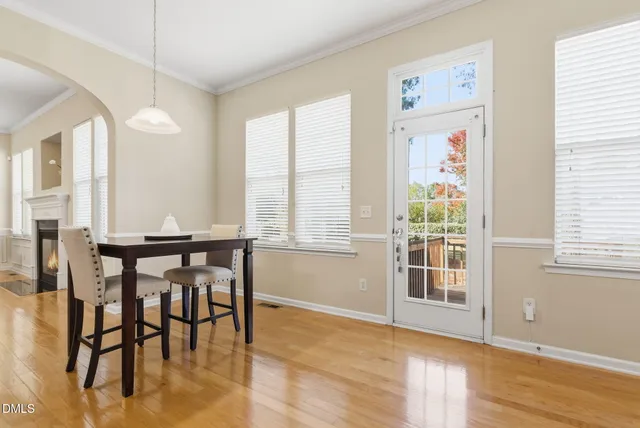 a view of a livingroom with furniture window and wooden floor