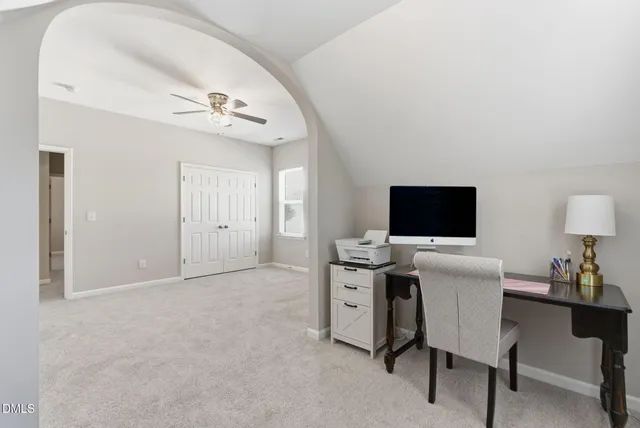 a view of a livingroom with furniture and a flat screen tv