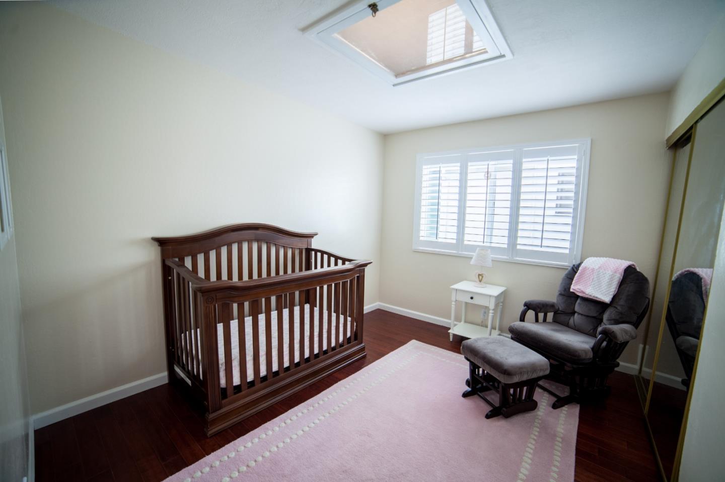 438 Firecrest Avenue Pacifica, CA 94044 - Photo 17 of 27 a bedroom with a window