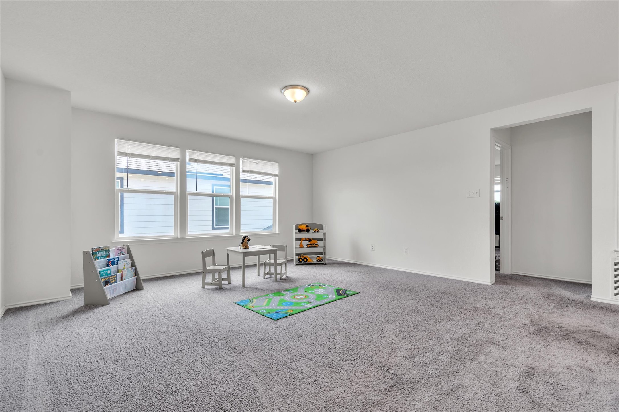 282 Crimson Lane Kyle, TX 78640 - Photo 8 of 18 Recreation room with carpet