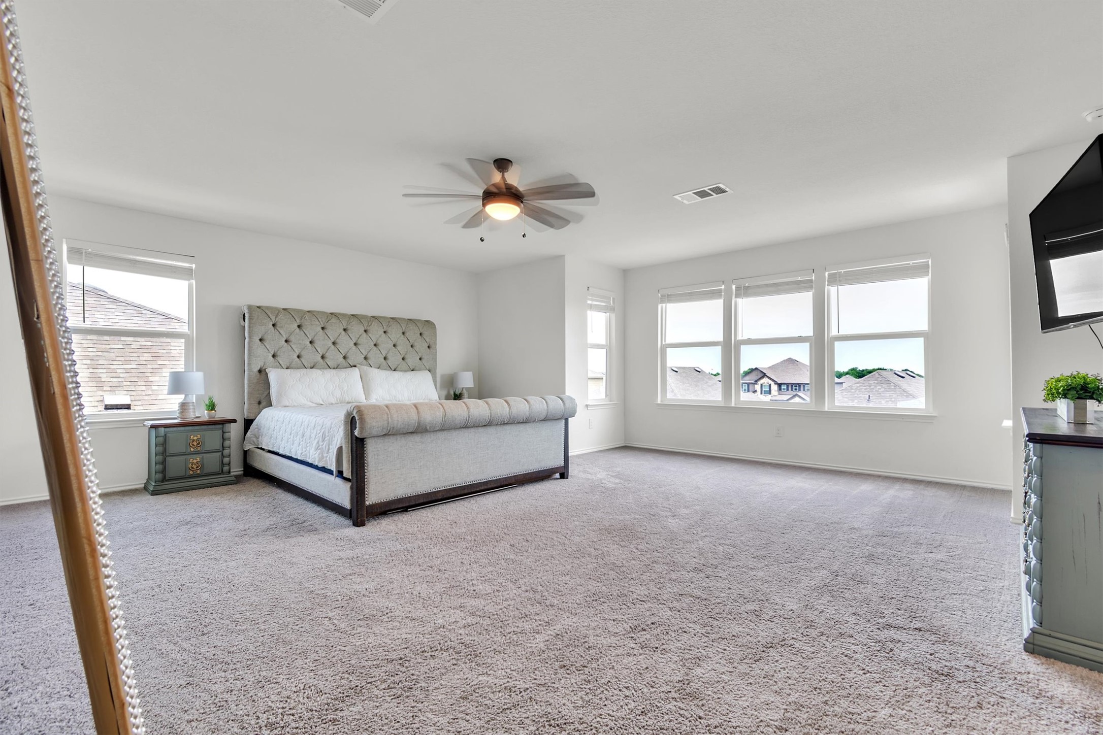 282 Crimson Lane Kyle, TX 78640 - Photo 10 of 18 Bedroom with light colored carpet and a ceiling fan