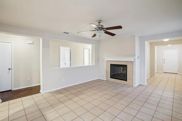 a view of empty room with fan