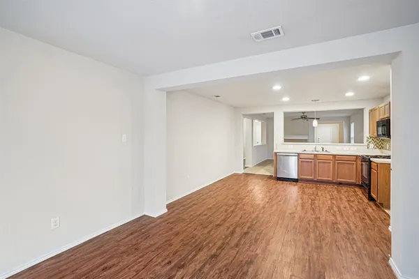a view of kitchen with wooden floor