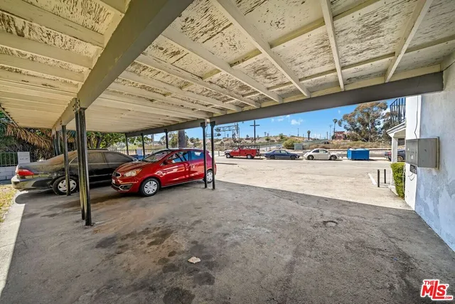 a view of a white building with large windows