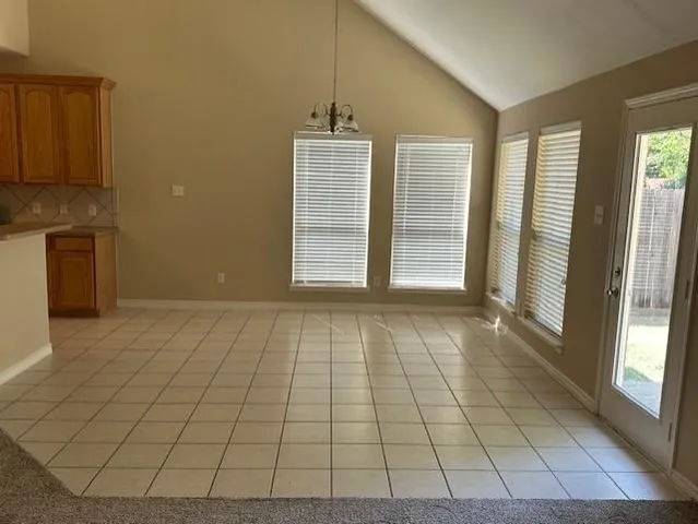 a kitchen with a sink appliances and cabinets
