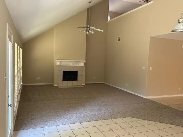 an empty room with a fireplace