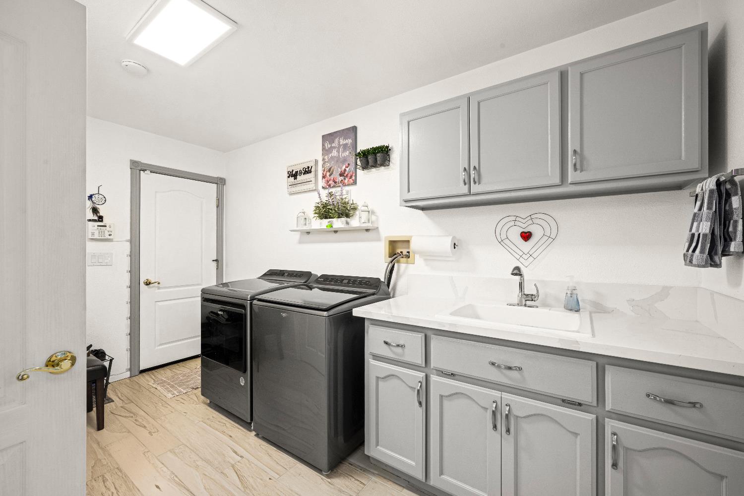 1049 Kimi Way Placerville, CA 95667 - Photo 18 of 66 a kitchen with stainless steel appliances granite countertop a sink stove and refrigerator