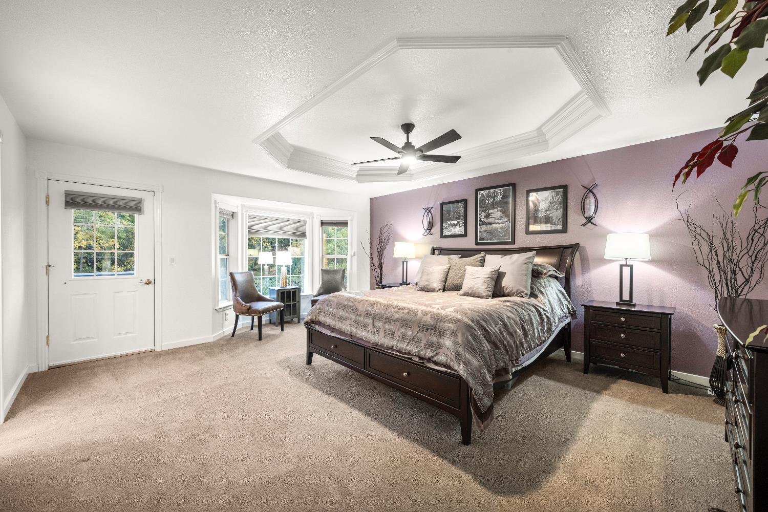 1049 Kimi Way Placerville, CA 95667 - Photo 31 of 66 a spacious bedroom with a large bed and a window