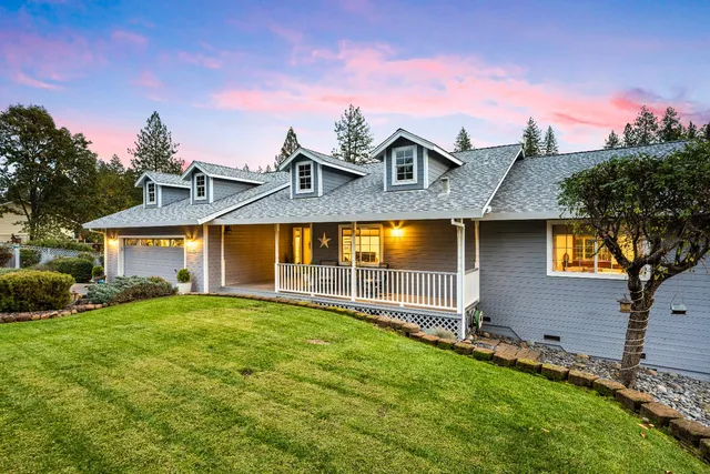 a view of living room filled with furniture and wooden floor