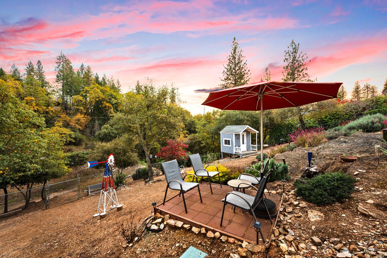1049 Kimi Way Placerville, CA 95667 - Photo 48 of 66 a view of a patio with furniture and a yard
