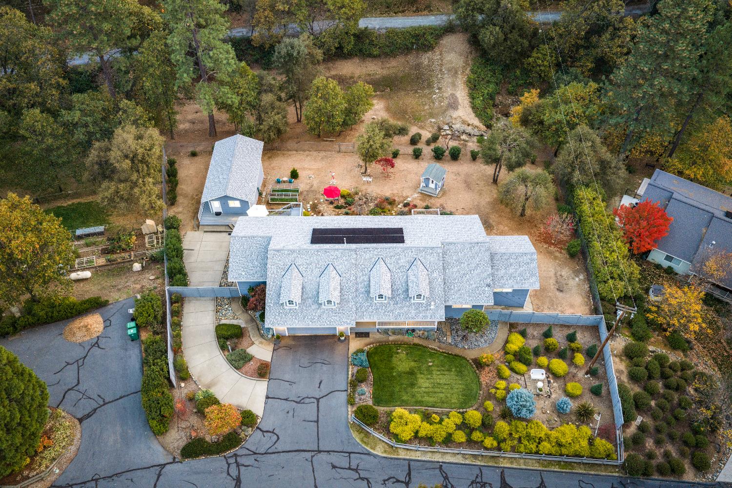 1049 Kimi Way Placerville, CA 95667 - Photo 53 of 66 an aerial view of a house with swimming pool and large trees