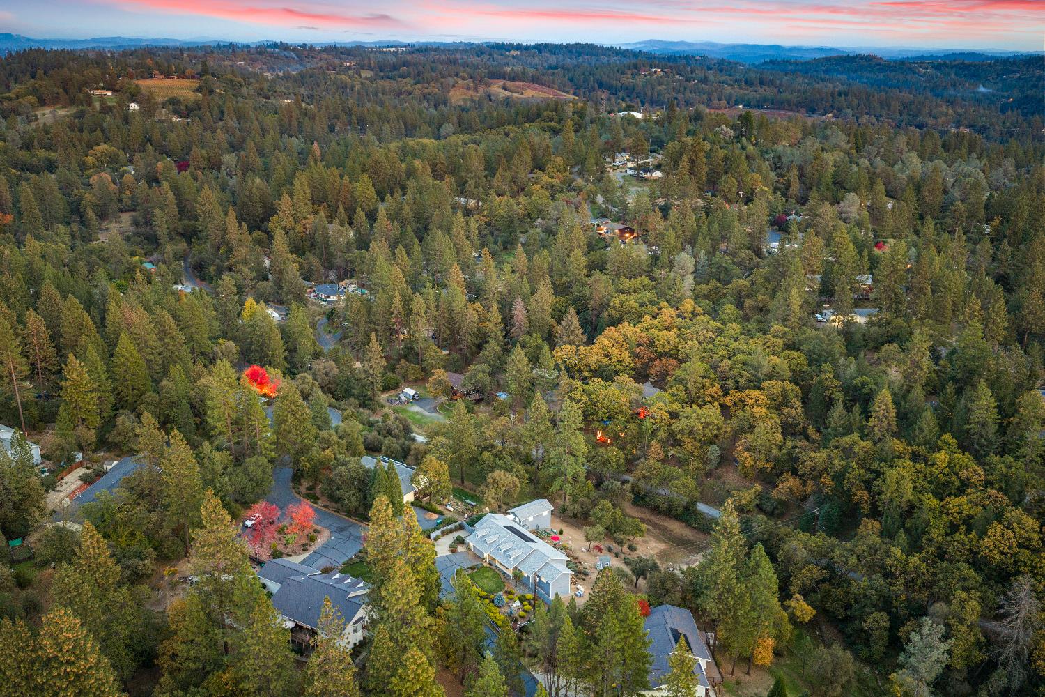 1049 Kimi Way Placerville, CA 95667 - Photo 59 of 66 an aerial view of residential houses with outdoor space and trees
