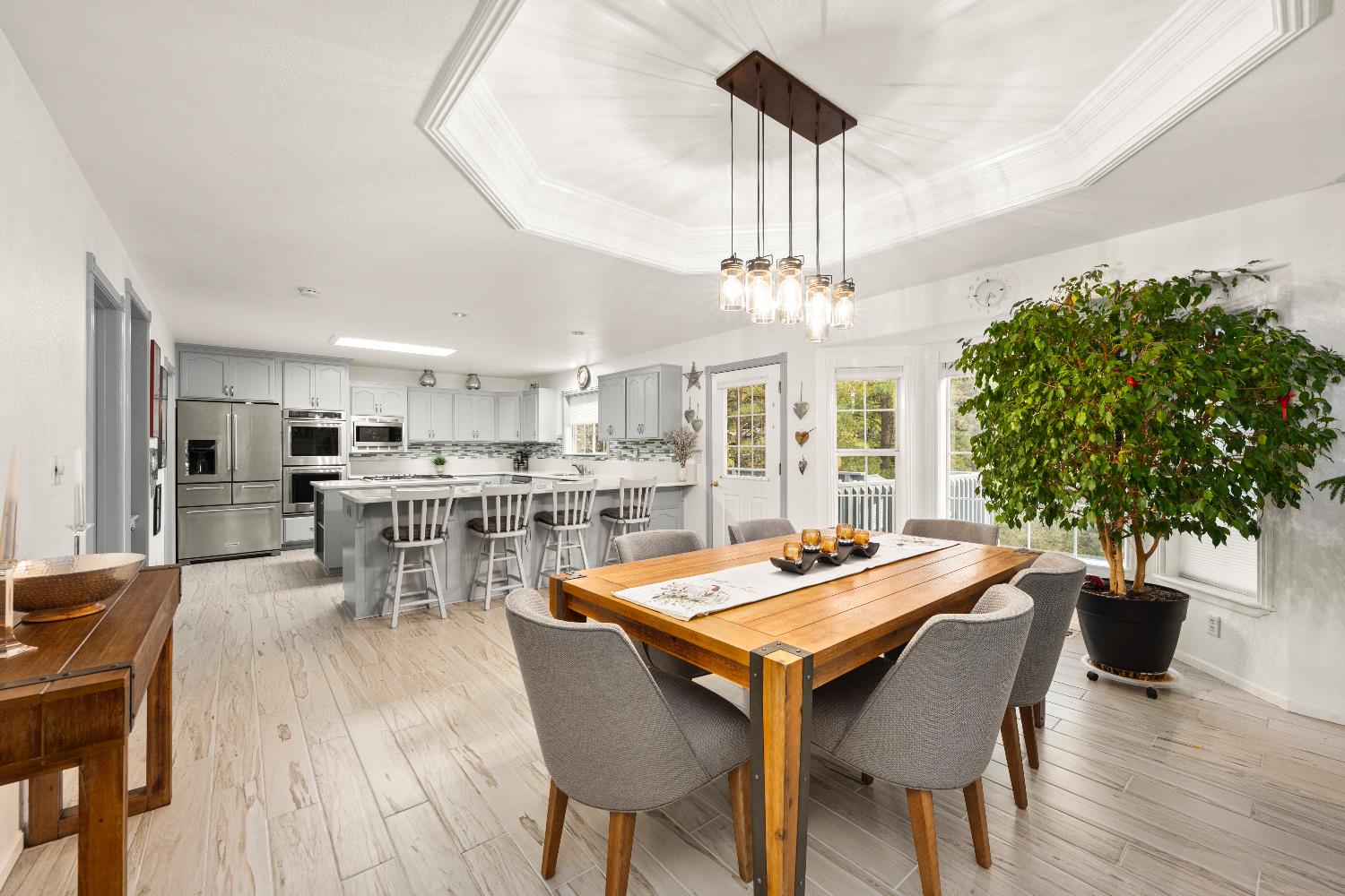 1049 Kimi Way Placerville, CA 95667 - Photo 7 of 66 a outdoor dining space with furniture and wooden floor