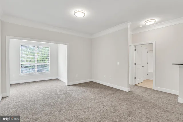 an empty room with a empty space and a window