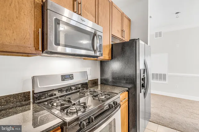 a kitchen with a stove and a microwave