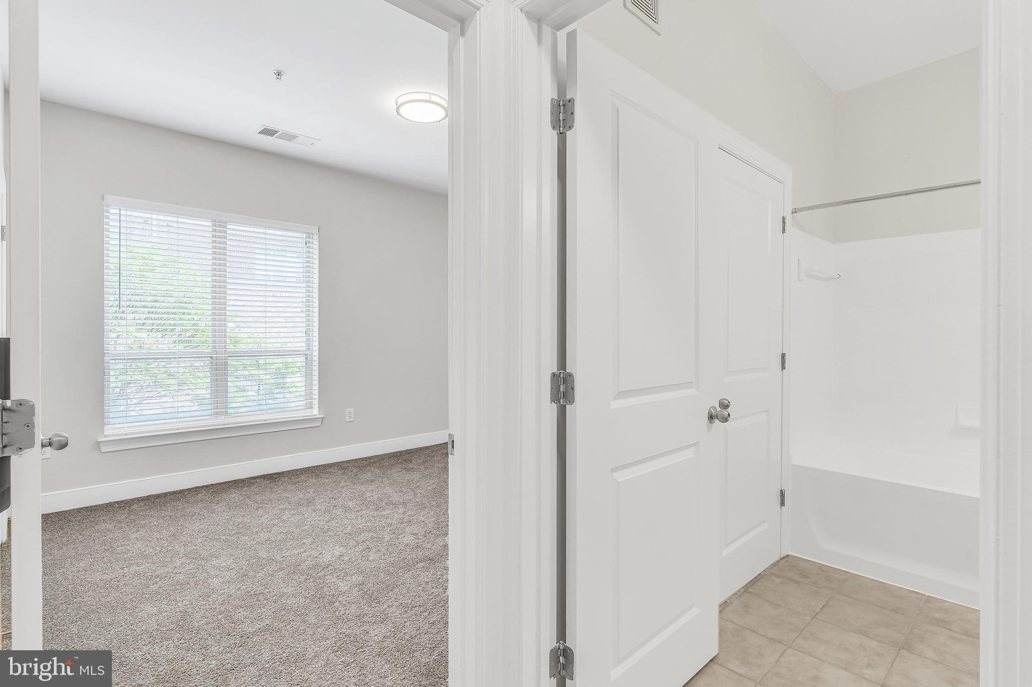5400 Auth Road, Unit 337 Suitland, MD 20746 - Photo 17 of 37 a view of an empty room with a window