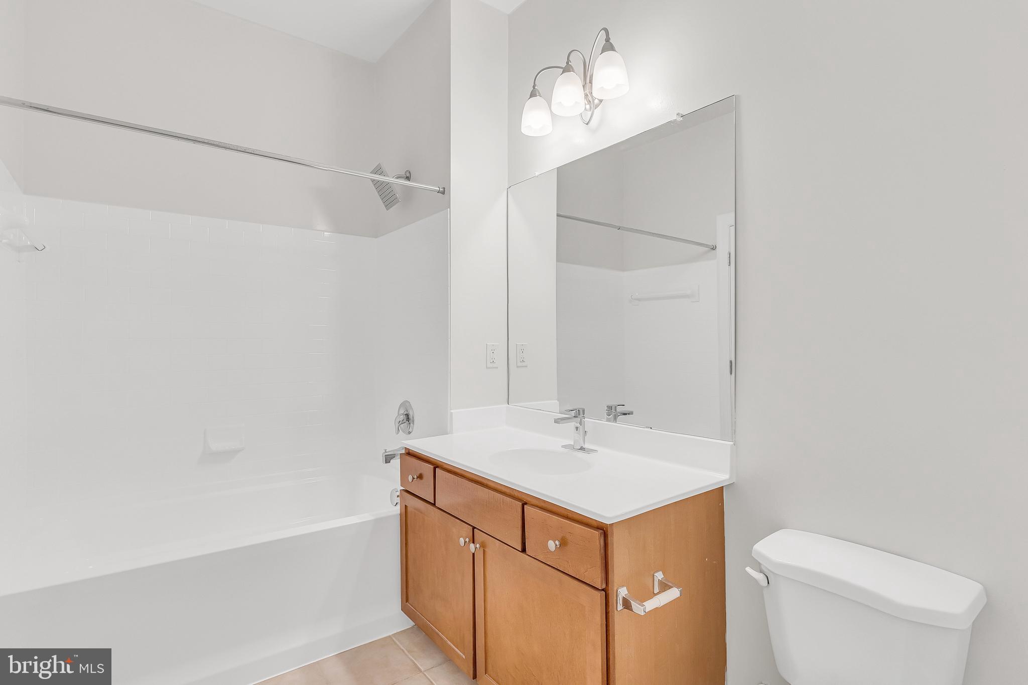 5400 Auth Road, Unit 337 Suitland, MD 20746 - Photo 18 of 37 a bathroom with a sink a toilet and shower