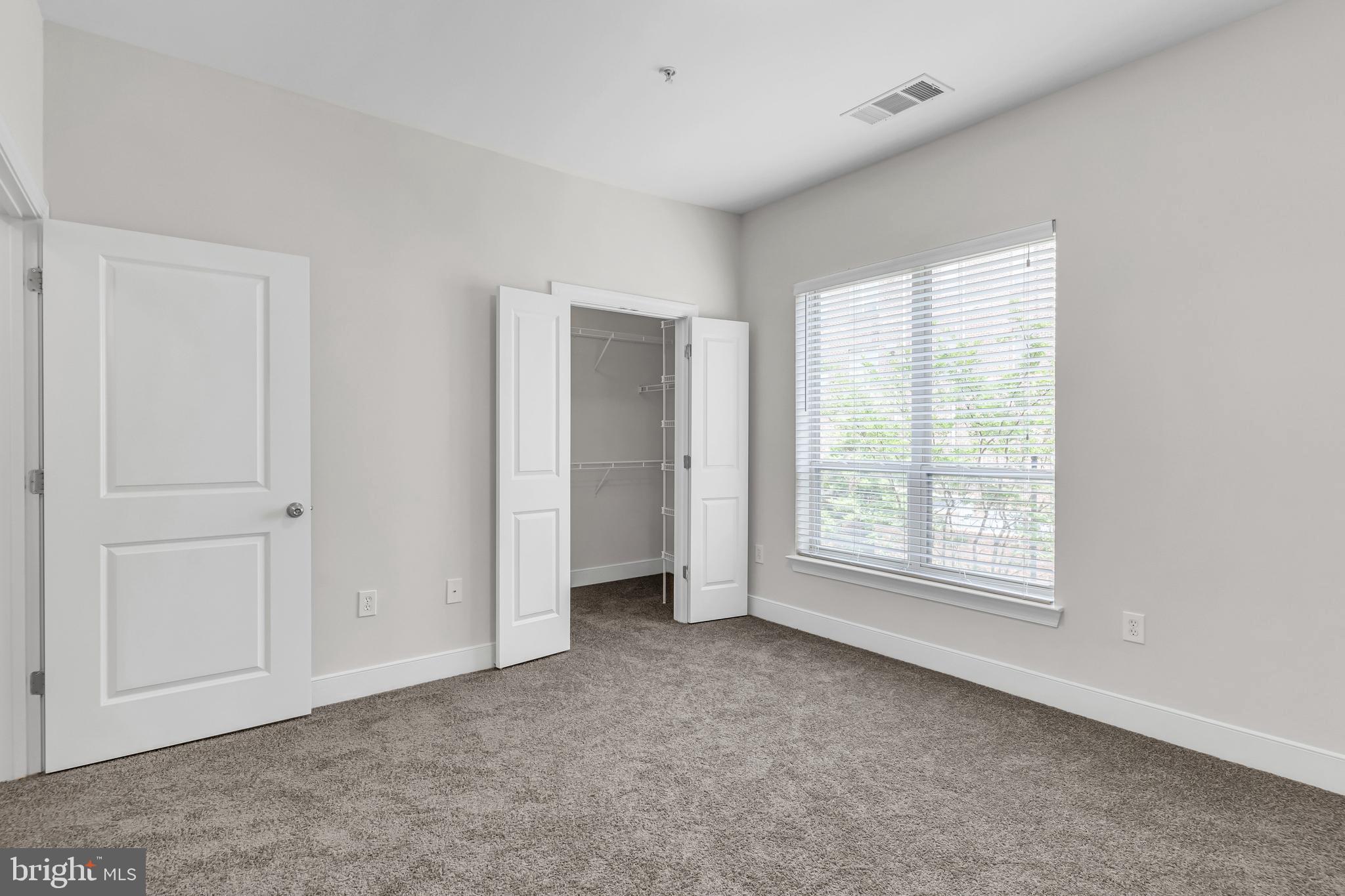 5400 Auth Road, Unit 337 Suitland, MD 20746 - Photo 21 of 37 a view of an empty room with a window