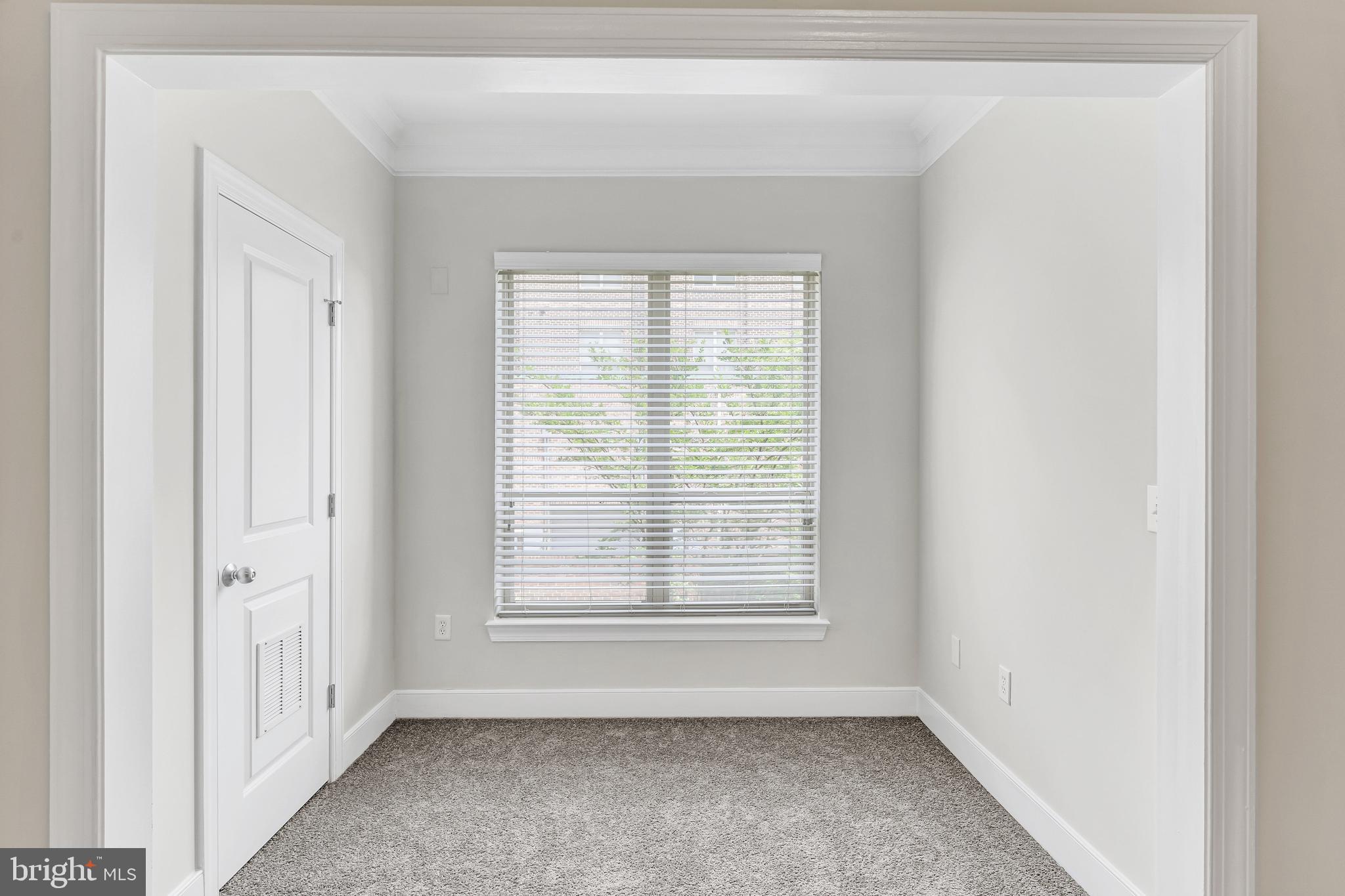 5400 Auth Road, Unit 337 Suitland, MD 20746 - Photo 23 of 37 a view of an empty room with a window