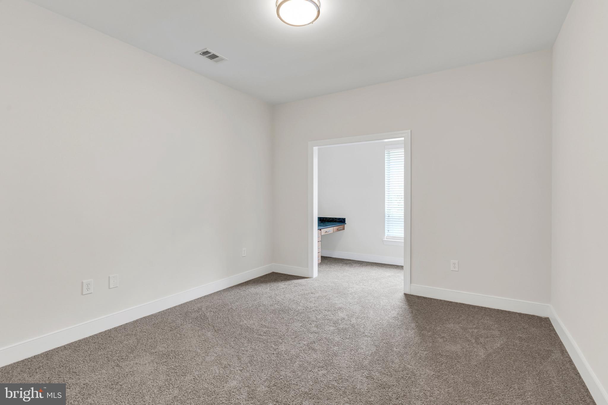 5400 Auth Road, Unit 337 Suitland, MD 20746 - Photo 25 of 37 a view of an empty room and a window