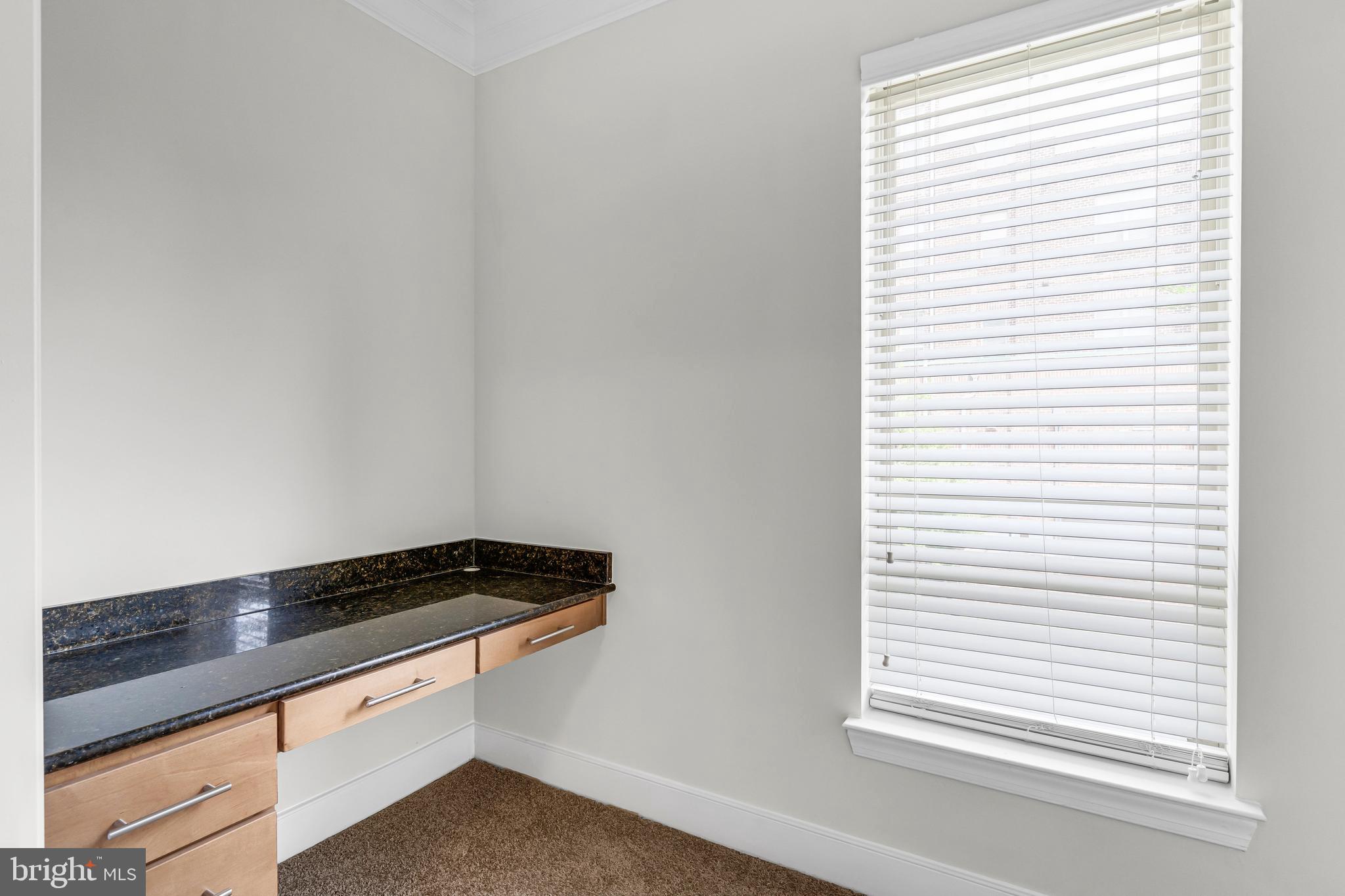 5400 Auth Road, Unit 337 Suitland, MD 20746 - Photo 30 of 37 a kitchen with a window and cabinets