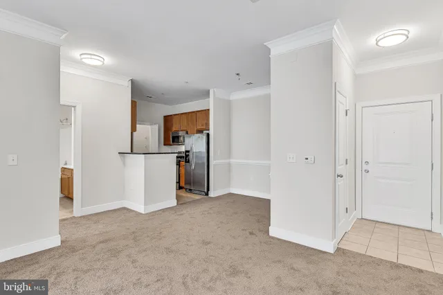 wooden floor and an empty room with a kitchen