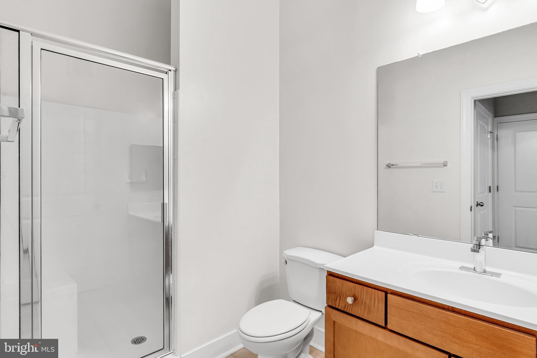 5400 Auth Road, Unit 337 Suitland, MD 20746 - Photo 32 of 37 a bathroom with a sink a toilet and shower