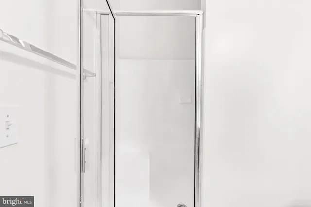 a view of a bathroom with a glass shower door