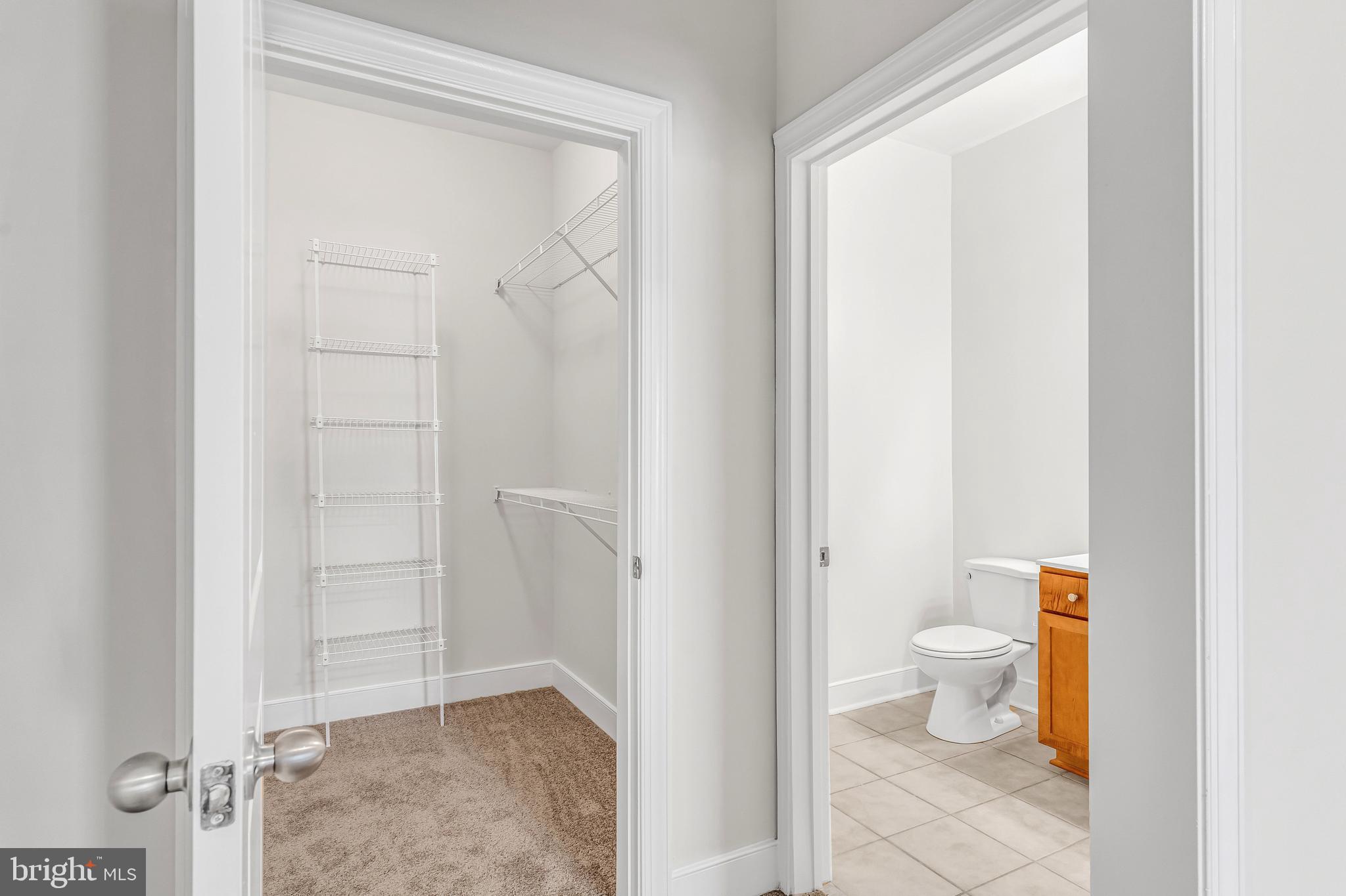 5400 Auth Road, Unit 337 Suitland, MD 20746 - Photo 35 of 37 a bathroom with a granite countertop toilet and a shower