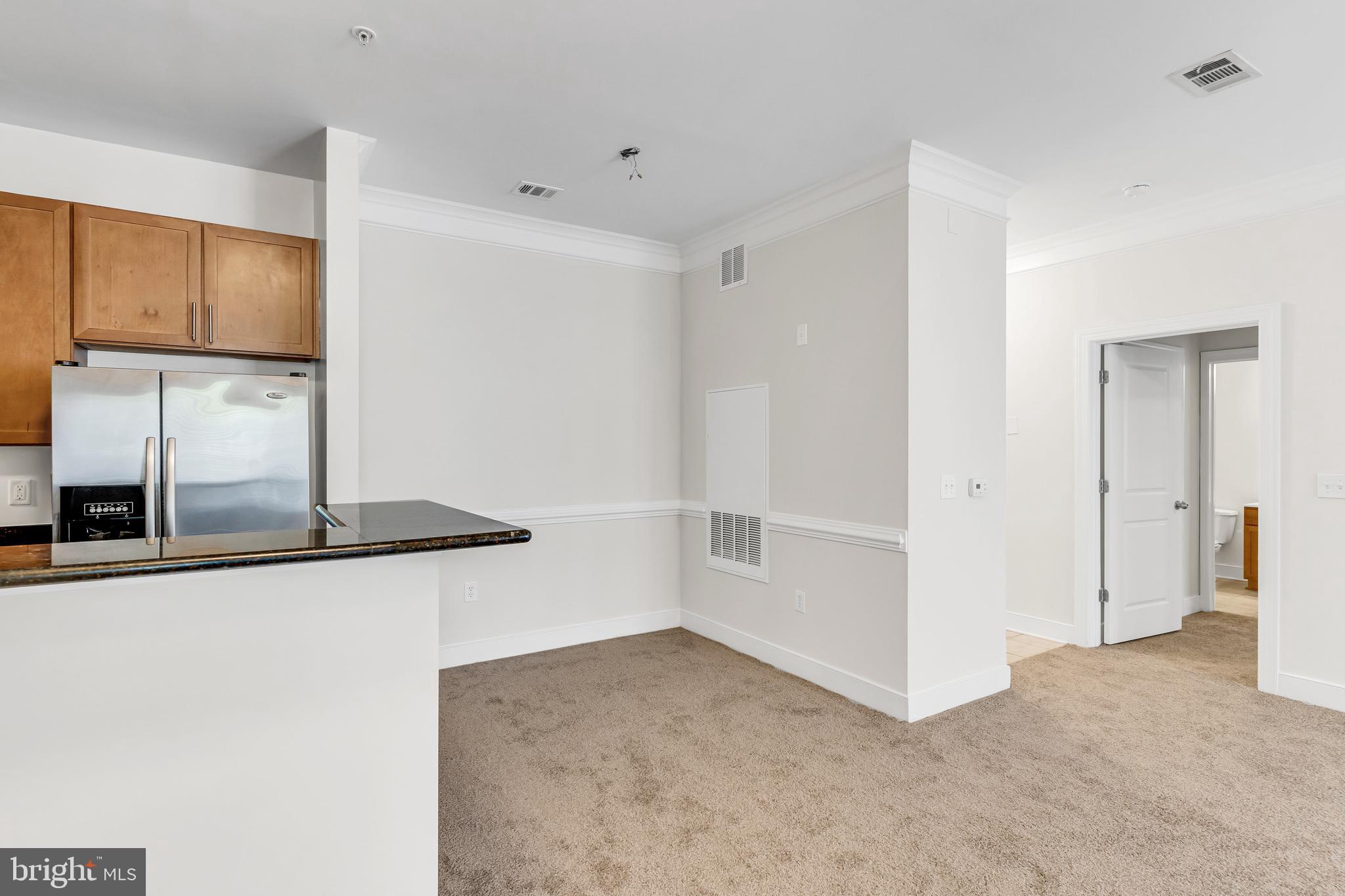 5400 Auth Road, Unit 337 Suitland, MD 20746 - Photo 7 of 37 a view of a refrigerator a kitchen and a window