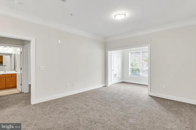 an empty room with a bathroom