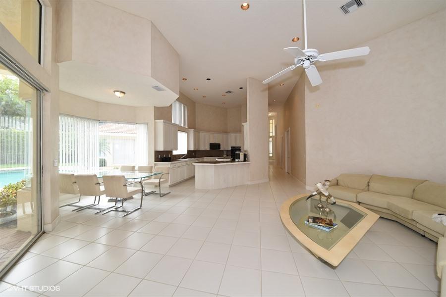 3912 Northwest 52nd Street Boca Raton, FL 33496 - Photo 11 of 17 07_3912NW52ndSt_94_FamilyRoomKitchen_Low